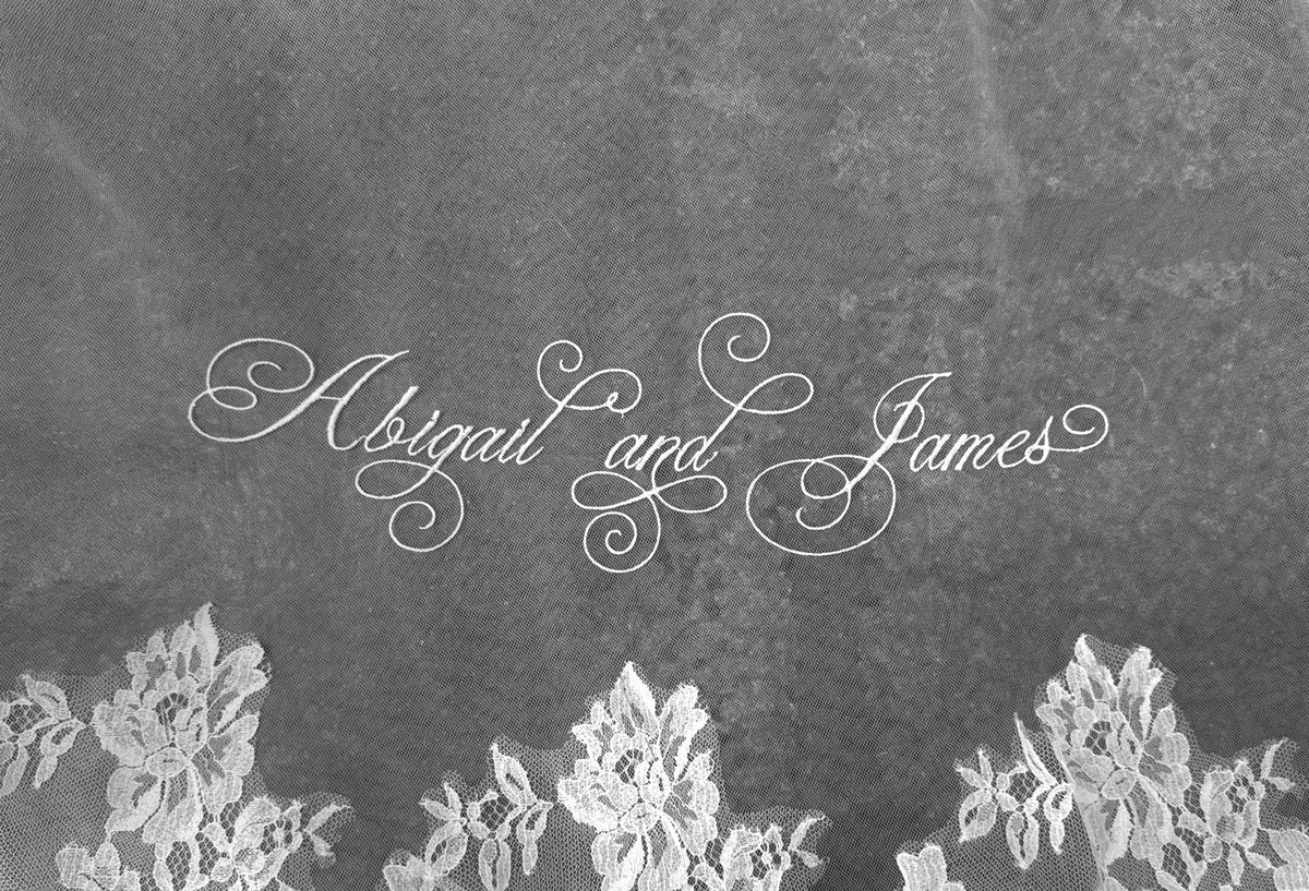Bridal accessories custom embroidery showcased on a Sara Gabriel veil with bride and groom names at One Fine Day Bridal Market